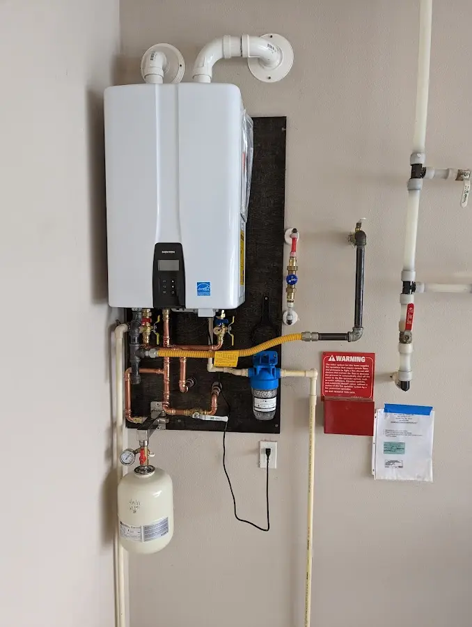 Professional plumber installing copper piping in a Buies Creek home